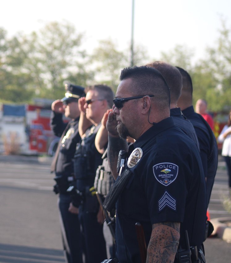 Members of the Brighton Police Department stand at attention during a program commemorating the 20th anniversary of 9/11.